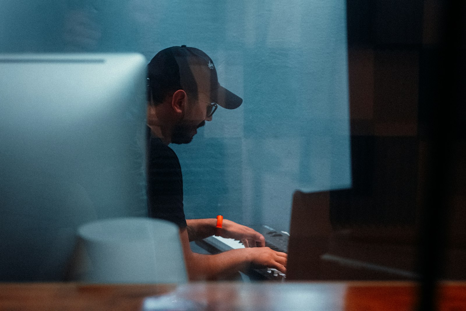 A designer working at a computer in a studio